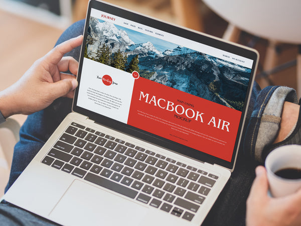 Free Man Using Macbook Air Mockup