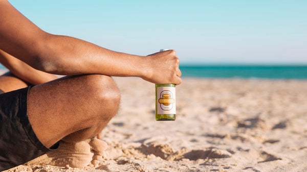 Free Man With Beer Bottle Mockup At The Beach Psd