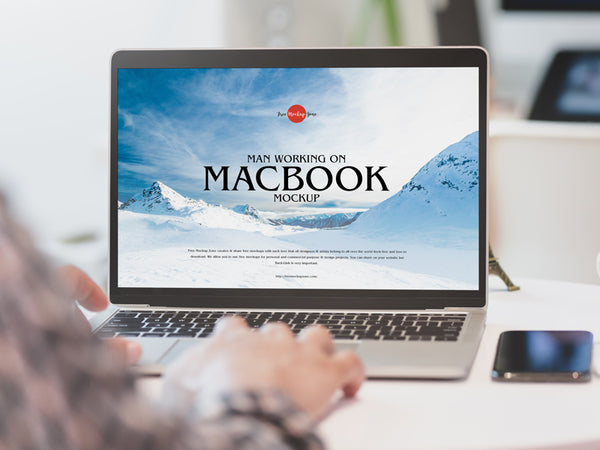 Free Man Working On Macbook Mockup