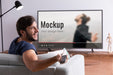 Free Medium Shot Smiley Man Watching Movie On Tv Psd