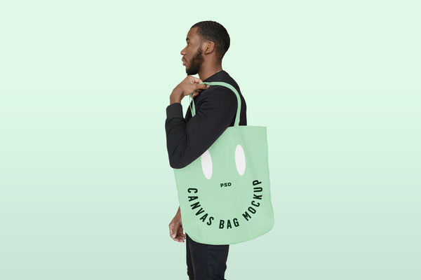 Free Men With Canvas Bag Mockup