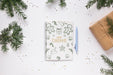 Free Merry Christmas Notebook On A Table Psd