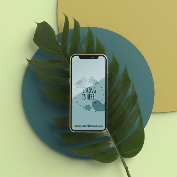 Free Mobile On 3D Leaf On Table Psd