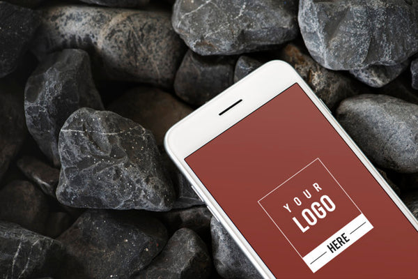 Free Mobile Phone On A Rocky Surface Psd