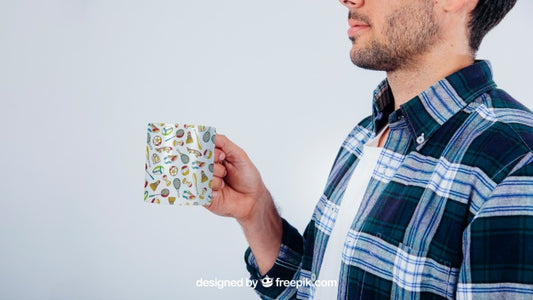 Free Mock Up Design With Young Guy Holding Coffee Mug Psd
