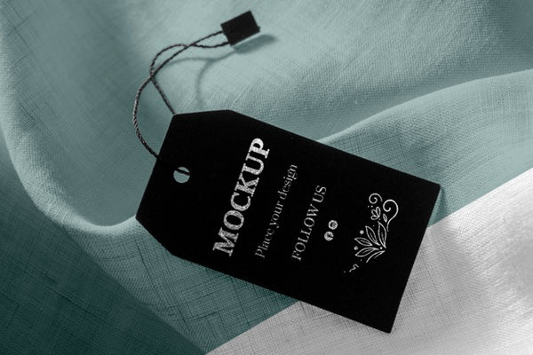 Free Mock-Up Of Clothing Black Labels On Soft Fabric Psd