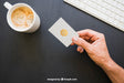 Free Mock Up Of Hand Holding Business Card With Coffe And Keyboard Psd