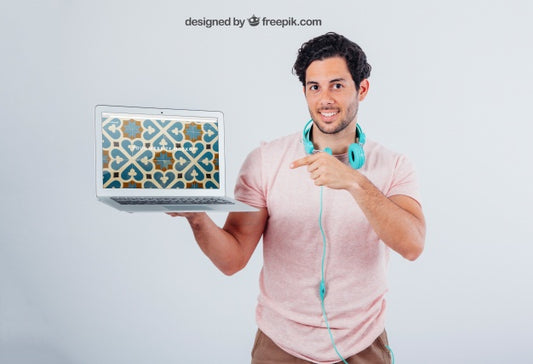 Free Mock Up Of Laptop'S Screen And Young Man Pointing Psd