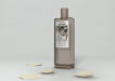 Free Mock-Up Perfume Bottle On Table Psd