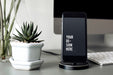 Free Mockup Of A Mobile Phone On A Stand Psd