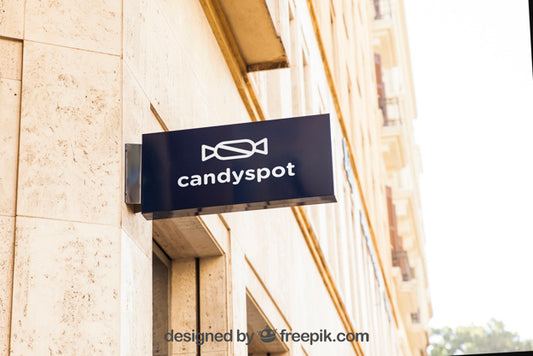 Free Mockup Of Black Shop Sign On Wall Psd