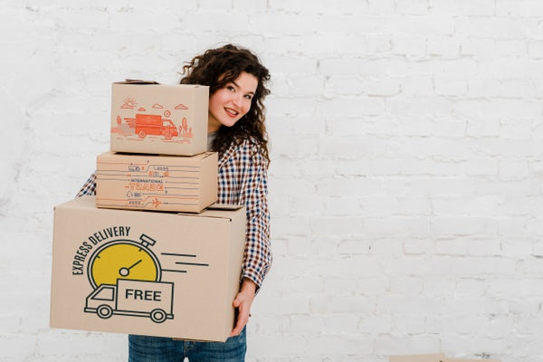 Free Mockup Of Woman With Cardboard Boxes Psd