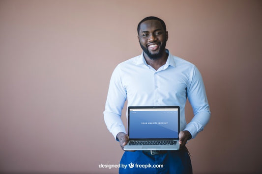 Free Modern Businessman Presenting Laptop Psd