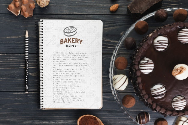Free Notebook Mockup With Delicious Pastry Psd