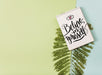 Free Notepad Mockup With Tropical Leaves Psd
