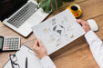 Free Office Desk With Person Holding Sheet Of Paper Mock-Up Psd