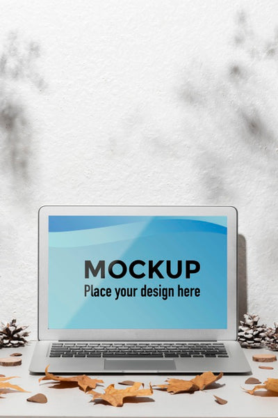 Free Opened Laptop Mockup On The Table Surrounded By Autumn Leaves Psd