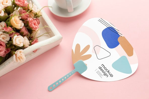 Free Paper Mock-Up Hand Fan With Flowers Bouquet And Cup Psd