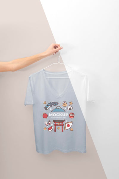 Free Person Holding A Japanese T-Shirt Mock-Up Psd