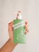 Free Person Holding A Liquid Soap Bottle Close-Up Psd