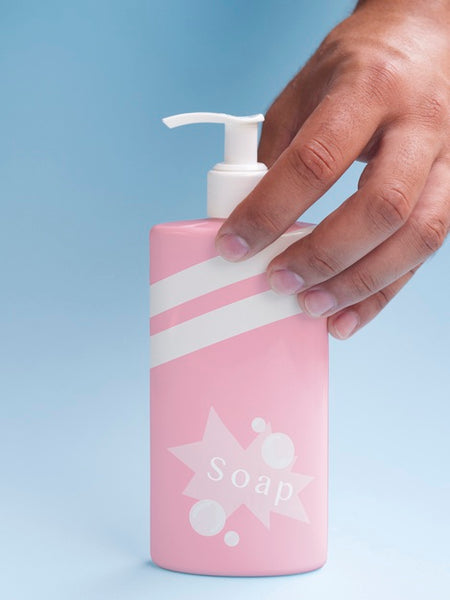 Free Pink Liquid Soap Bottle On Blue Background Psd