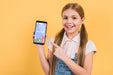 Free Portrait Of Young Girl Holding Mobile Phone Psd