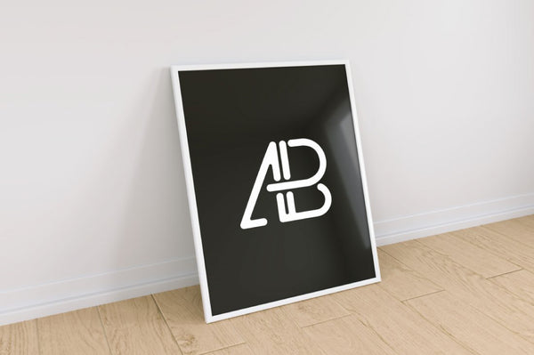 Free Poster Frame Against Wall Mockup