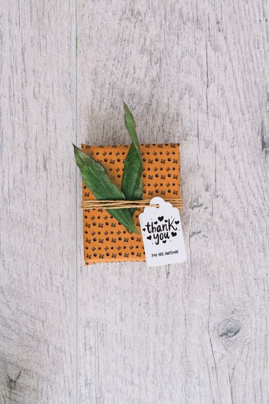 Free Present Box Mockup With Leaves Psd