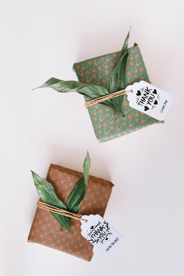 Free Present Box Mockup With Leaves Psd