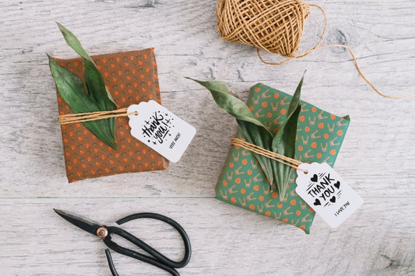 Free Present Box Mockup With Leaves Psd
