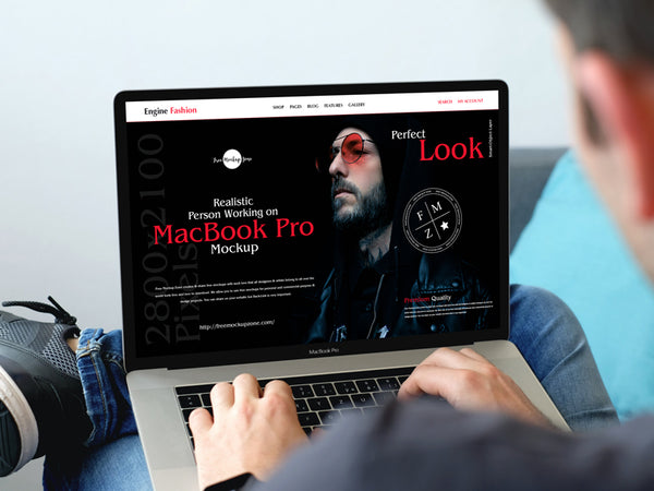 Free Realistic Person Working On Macbook Pro Mockup