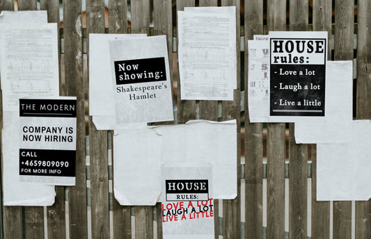 Free Sheets Of Paper Ads On A Wooden Fence Psd