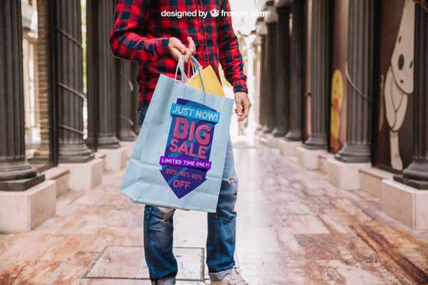 Free Shopping Bag Mockup With Man In Street Psd