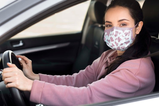 Free Side View Woman With Mask Driving Psd