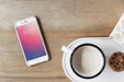 Free Smartphone Mockup Next To Coffee Psd