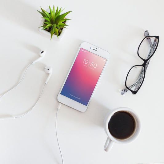 Free Smartphone Mockup With Charging Cable And Earphones Psd