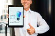Free Smiley Businessman Outdoors Holding Vertical Digital Tablet Psd
