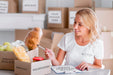 Free Smiley Female Volunteer Counting Food For Donation Boxes Psd