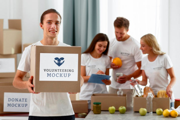 Free Smiley Male Volunteer Holding Box With Donations Psd