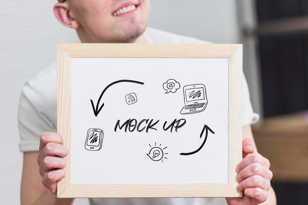 Free Smiley Man Holding Mock-Up Frame Psd