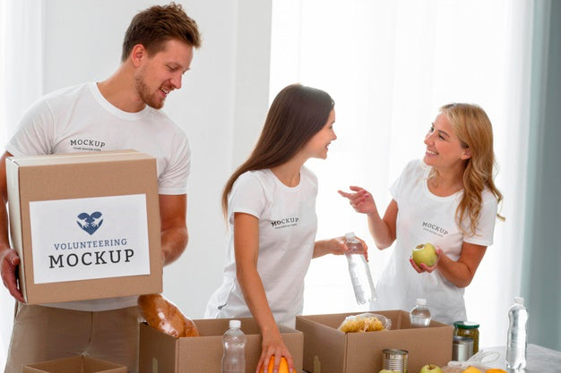 Free Smiley Volunteers Preparing Food For Donation In Boxes Psd