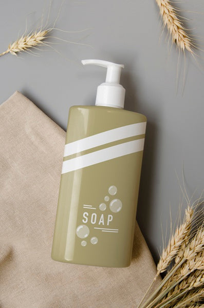 Free Soap Bottle On Grey Background Psd