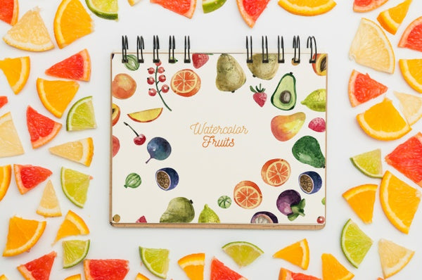 Free Spiral Notebook Mockup With Fruits Psd