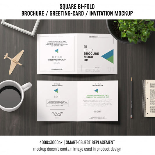 Free Square Bi-Fold Brochure Or Greeting Card Mockup On Workspace Psd