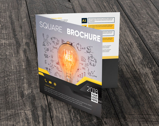 Free Square Brochure Mockup On Wooden Surface Psd