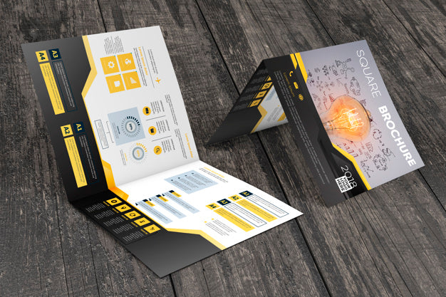 Free Square Brochure Mockup On Wooden Surface Psd