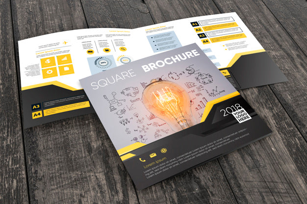 Free Square Brochure Mockup On Wooden Surface Psd