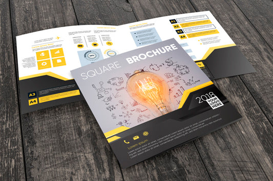 Free Square Brochure Mockup On Wooden Surface Psd