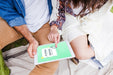 Free Summer Camp Mockup With Couple Using Tablet Psd