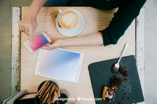 Free Tablet And Smartphone Mockup With Top View Of Desk Psd